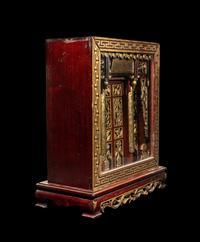 A Chinese Carved Gilt and Red Lacquered Wood Shrine