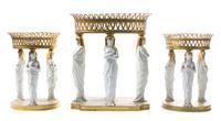 A French Gilt Bronze and Parian Table Garniture Height of tallest 16 x width 14 inches. — RISLER & CARRE, PARIS, 19TH CENTURY