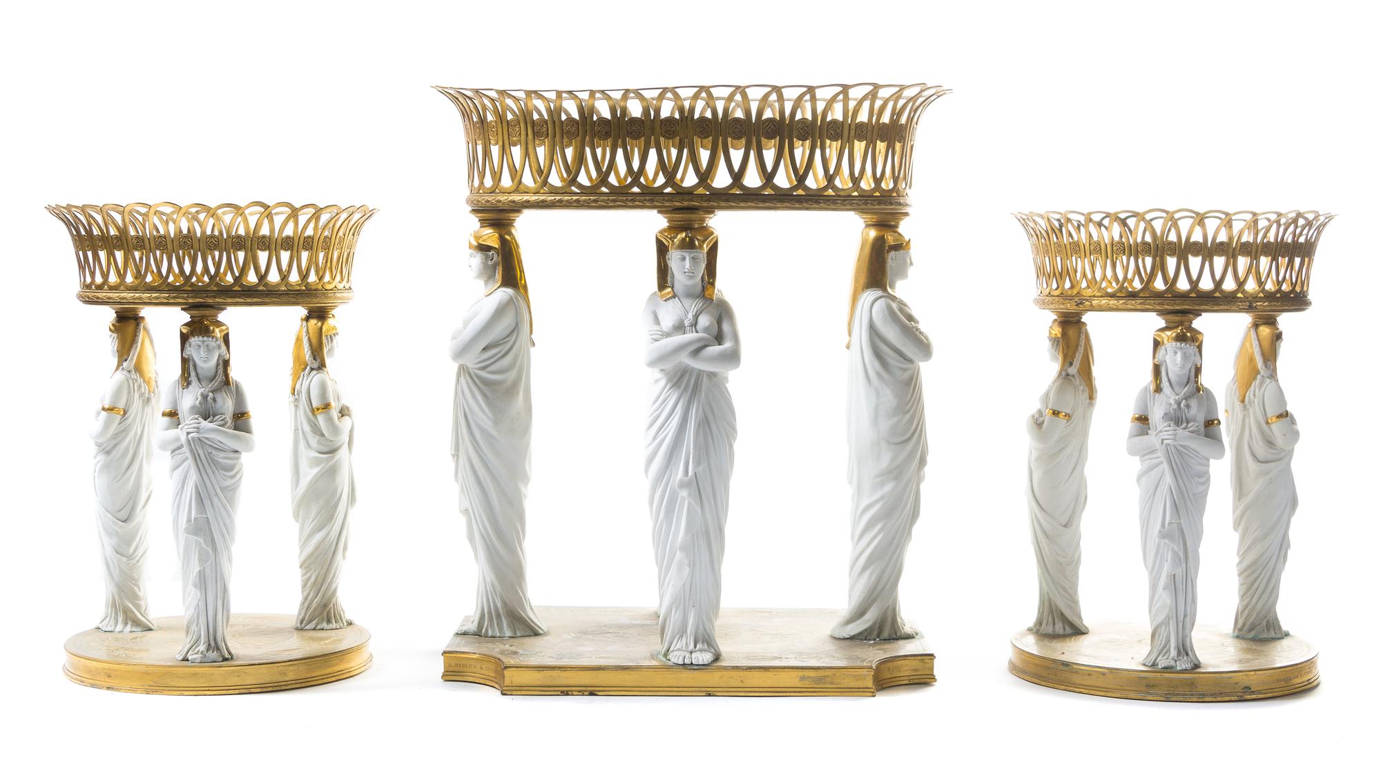 A French Gilt Bronze and Parian Table Garniture Height of tallest 16 x width 14 inches. — RISLER & CARRE, PARIS, 19TH CENTURY