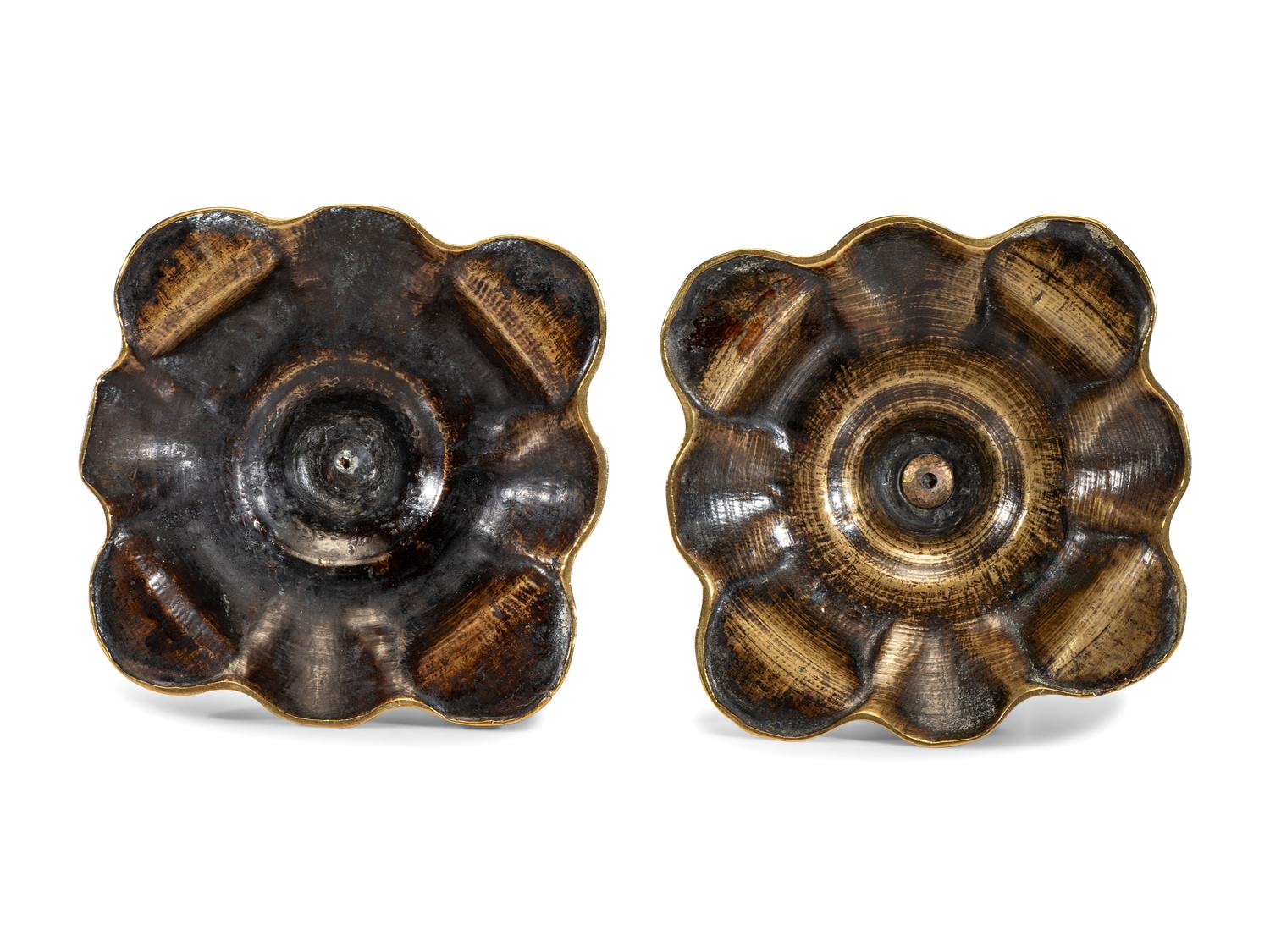 A Pair of Queen Anne Brass Petal Base Candlesticks