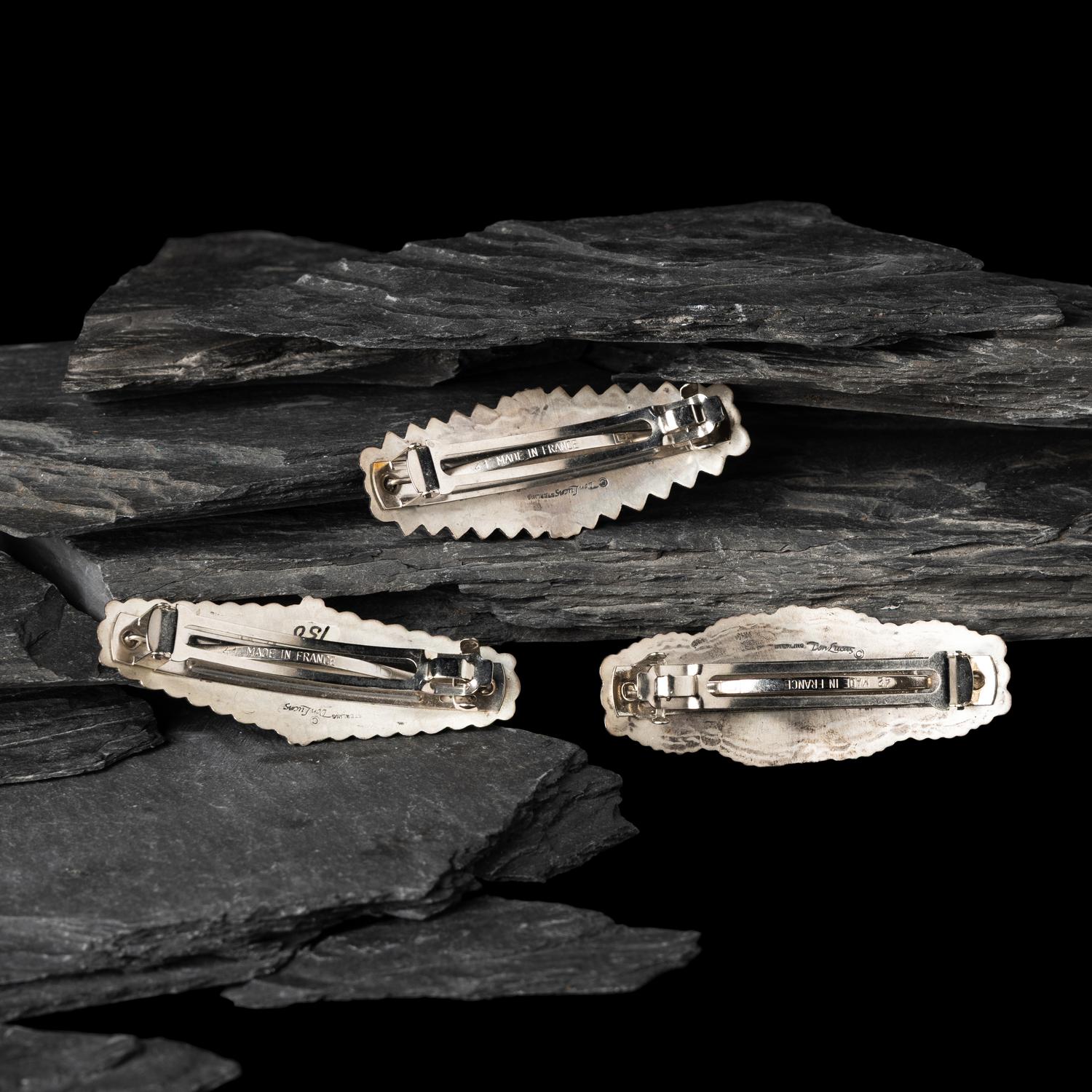 Don Lucas (American, 20th century) — Southwestern-style Sterling Silver and Cluster Inlay Hair Barrettes and Post Earrings