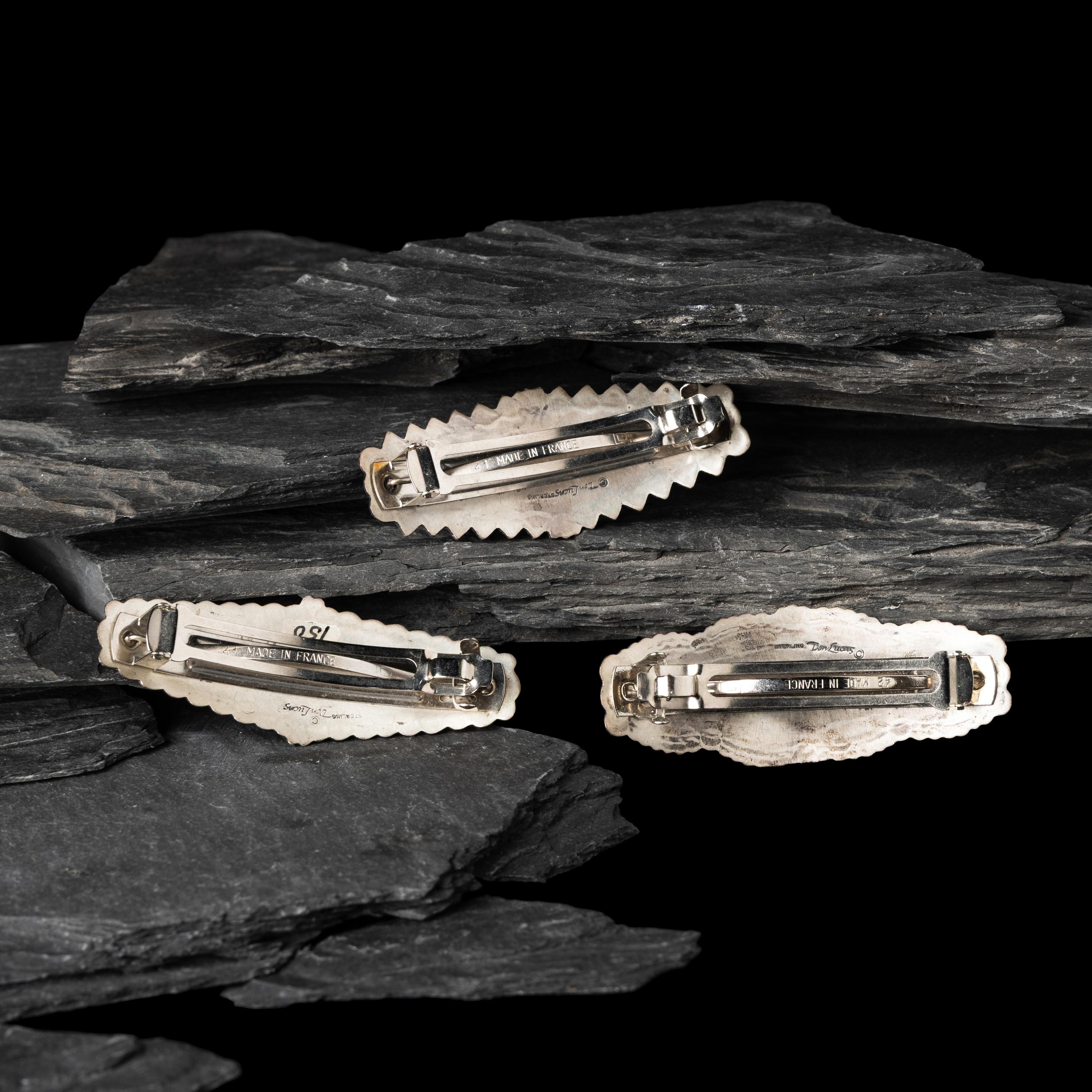 Don Lucas (American, 20th century) — Southwestern-style Sterling Silver and Cluster Inlay Hair Barrettes and Post Earrings