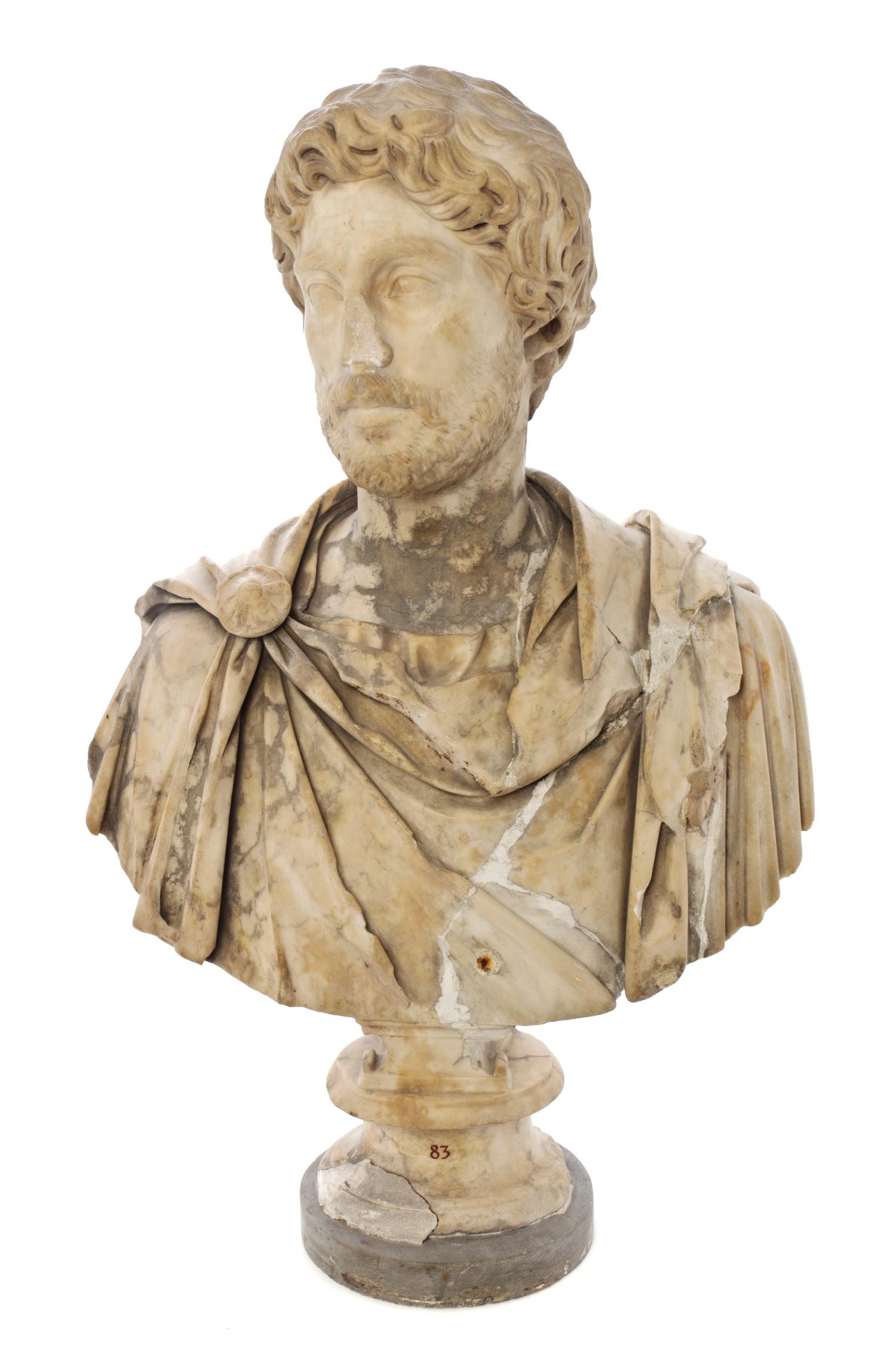 An Italian Carved Marble Bust, after the Antique, Height overall 30 3/4 inches.