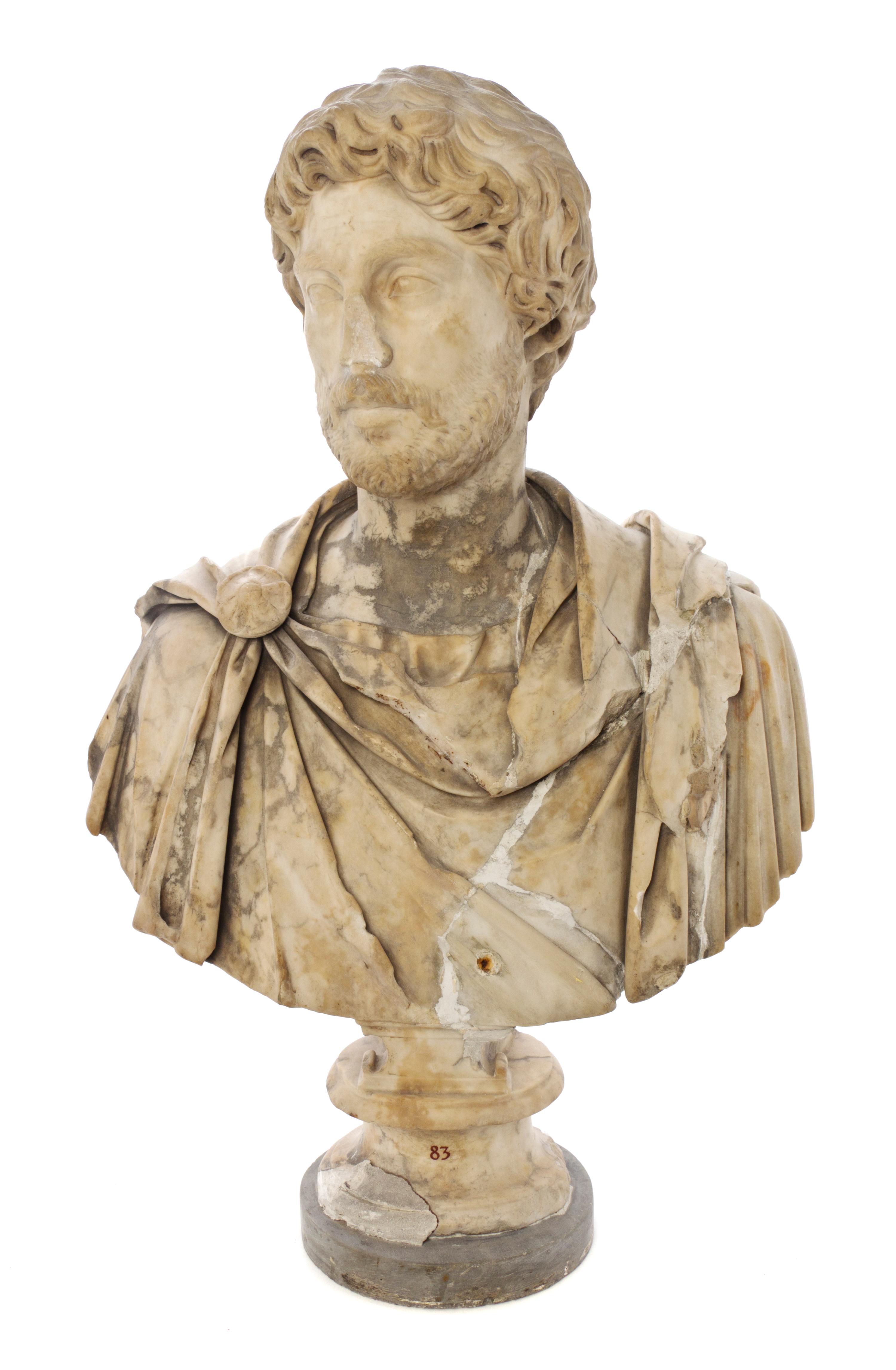 An Italian Carved Marble Bust, after the Antique, Height overall 30 3/4 inches.