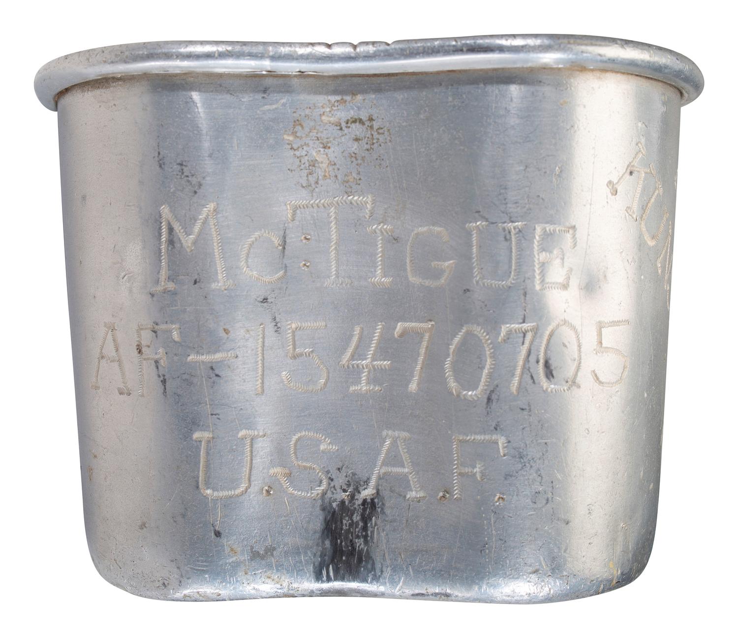 [MILITARIA]. World War II and Korean War-era canteens, canteen covers, and mess kits.
