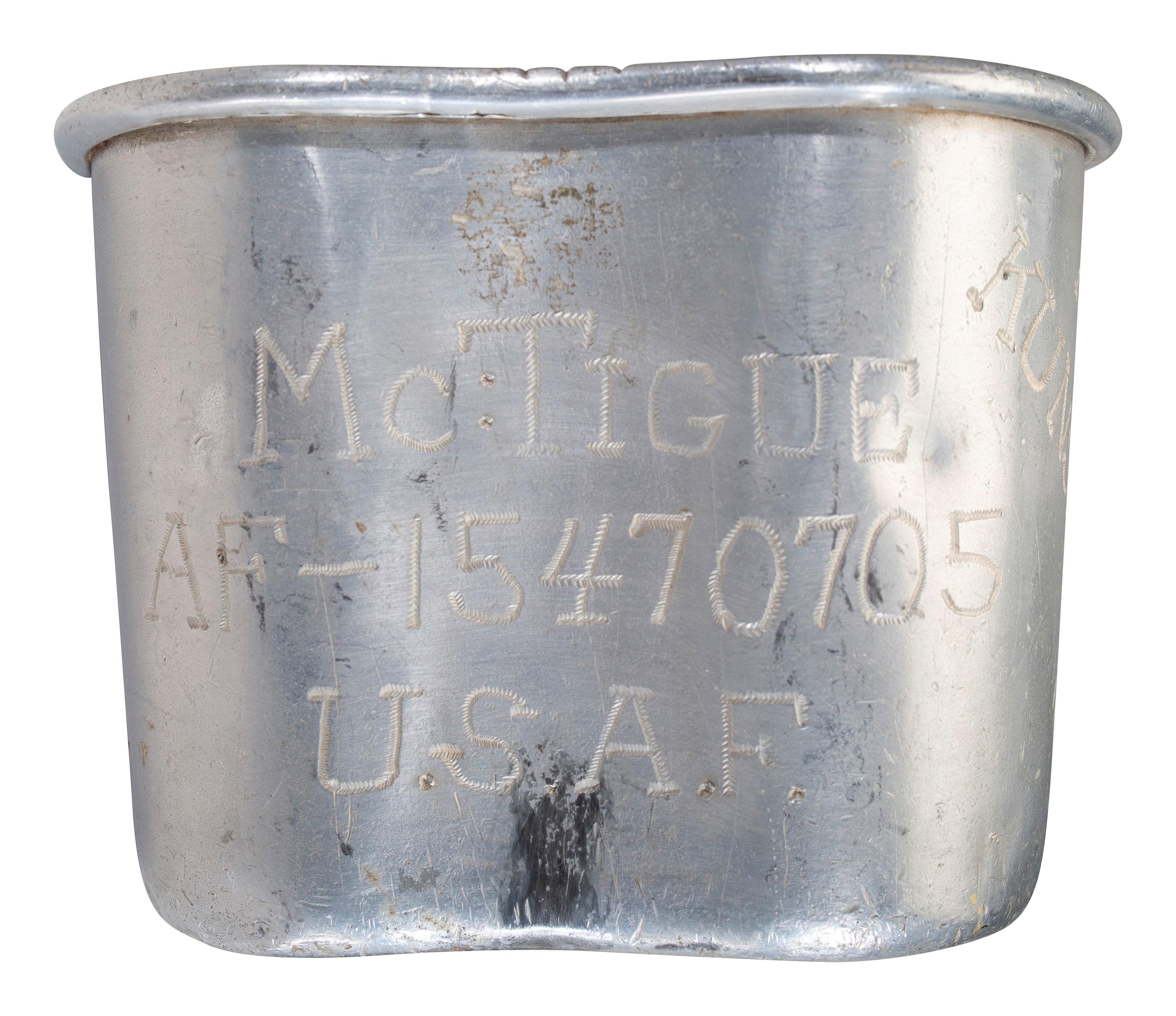 [MILITARIA]. World War II and Korean War-era canteens, canteen covers, and mess kits.