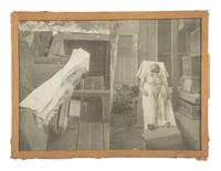 [INDIAN WARS]. 2 photographs of a cadaver, possibly a victim of a Native American attack.