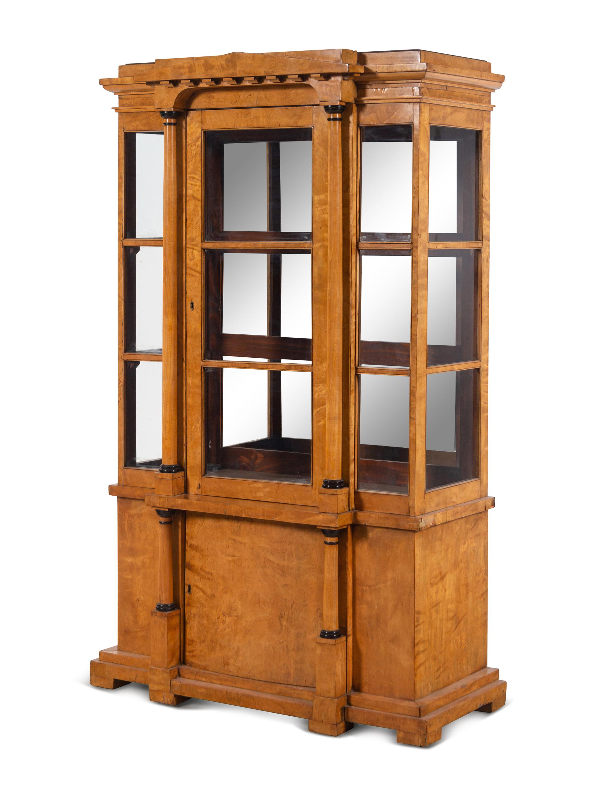 A German or Austrian Neoclassical Parcel Ebonized Birch Breakfront Vitrine Cabinet