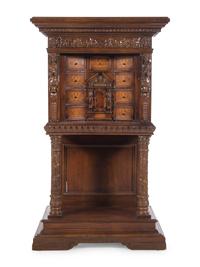 A Renaissance Revival Carved Walnut and Marquetry Collector's Cabinet