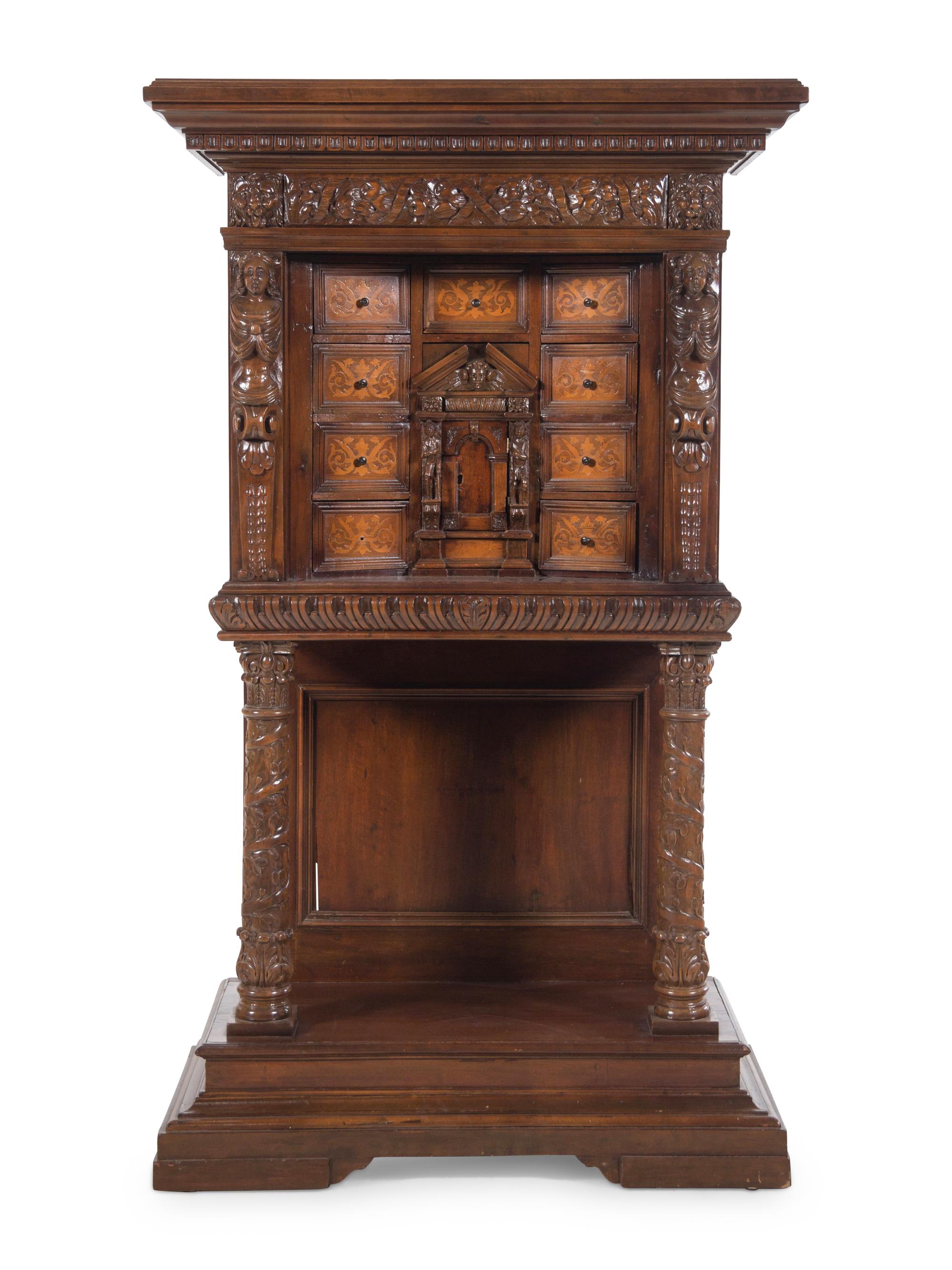 A Renaissance Revival Carved Walnut and Marquetry Collector's Cabinet