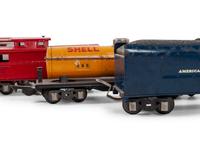 A Lionel 385E Loco Engine and Tender, Three Lionel Train Cars, Four American Flyer Line Cars and Other Accessories