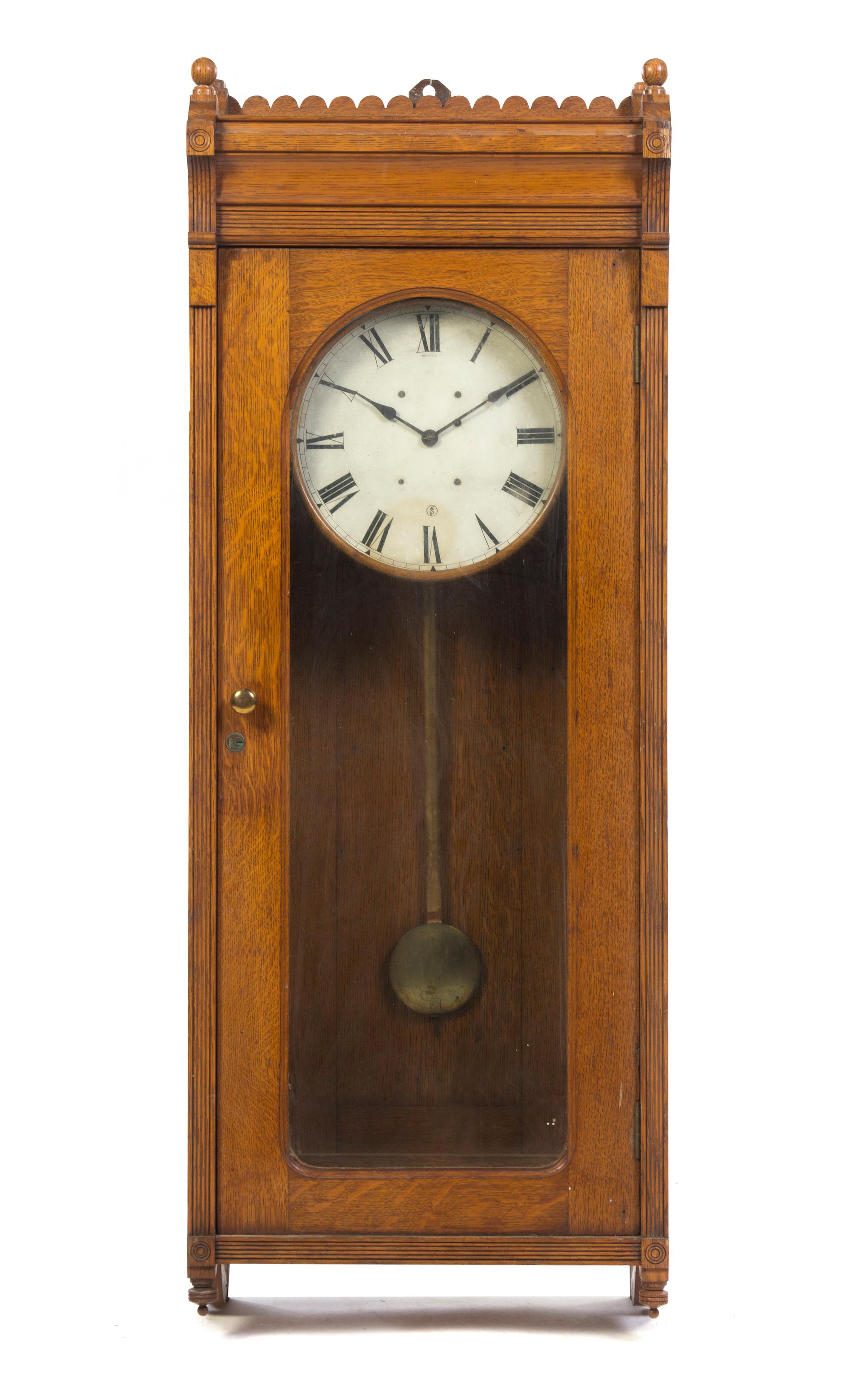 An American Oak Regulator Clock, Height 57 1/4 inches.