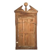 A Large Neoclassical Carved Walnut Mirror