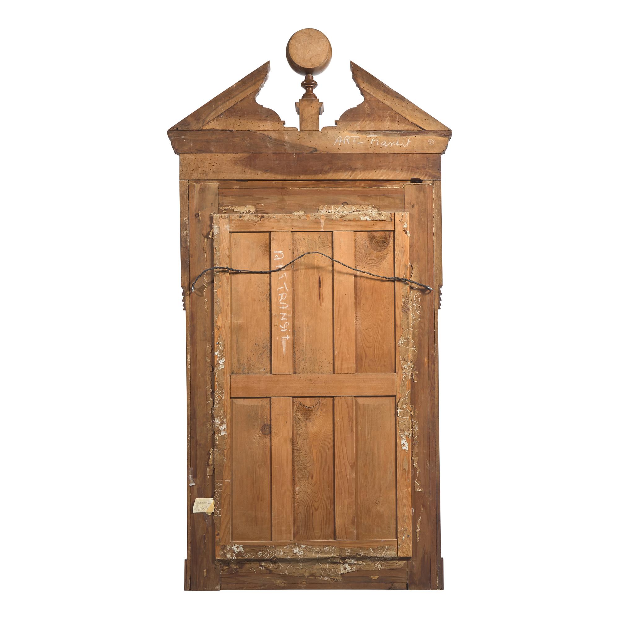 A Large Neoclassical Carved Walnut Mirror