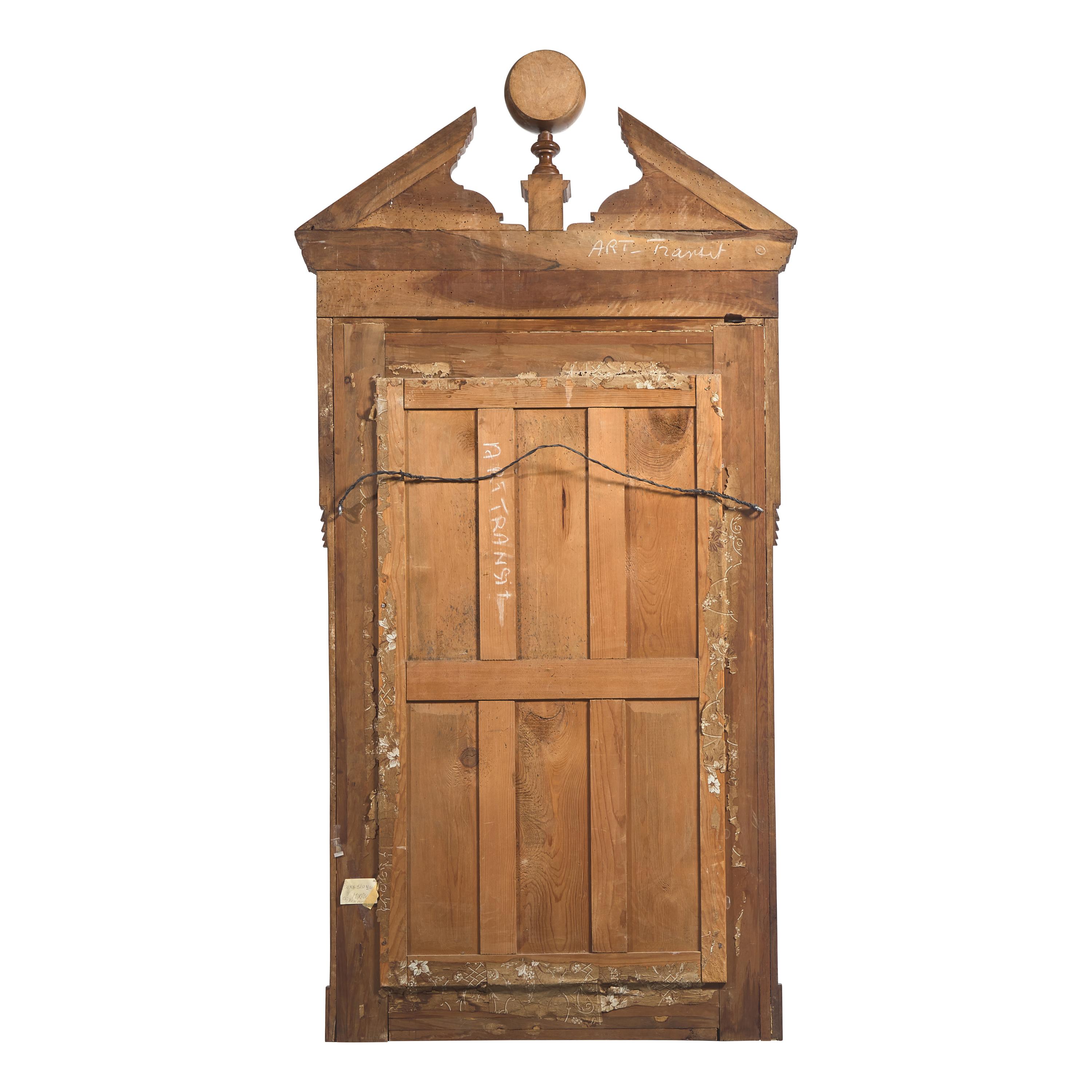 A Large Neoclassical Carved Walnut Mirror