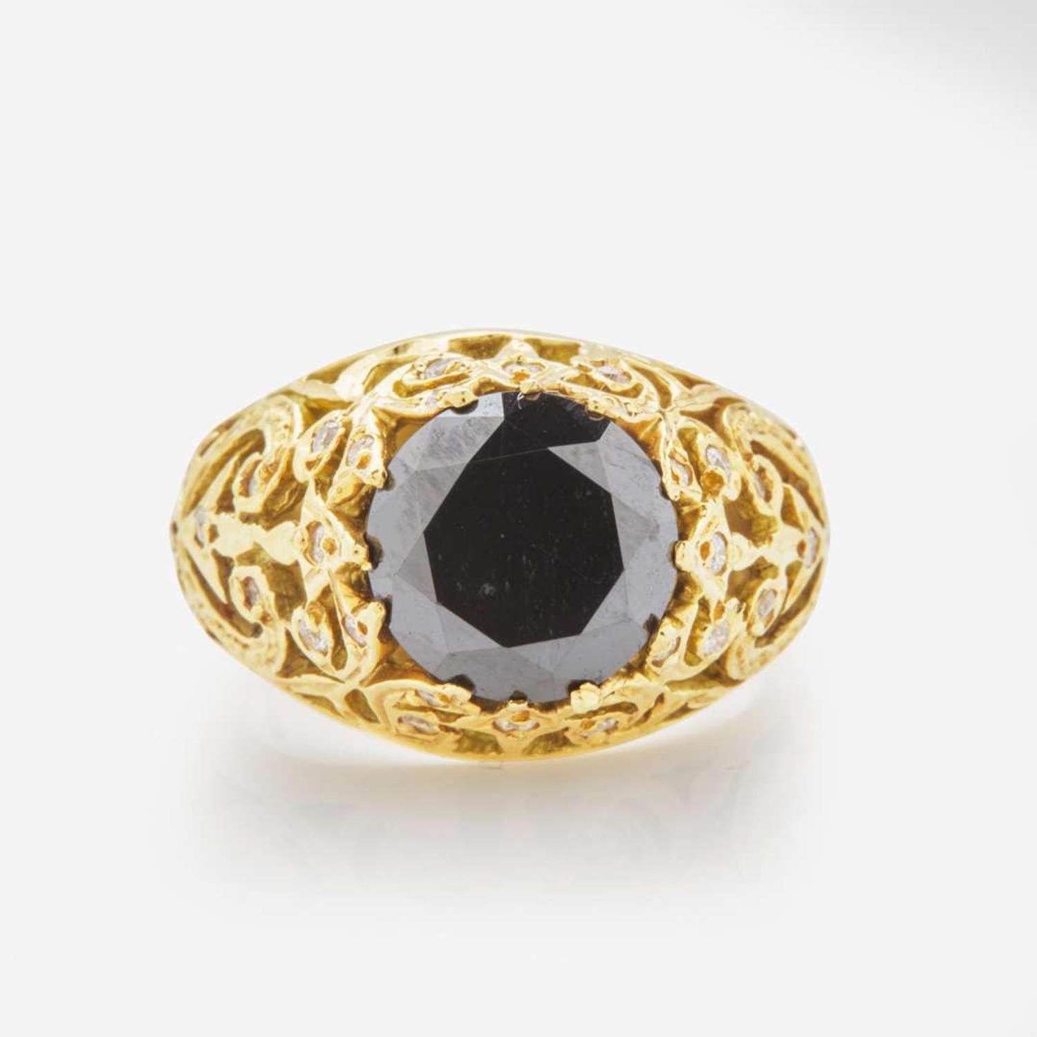 An 18K Yellow Gold and Black Diamond Ring