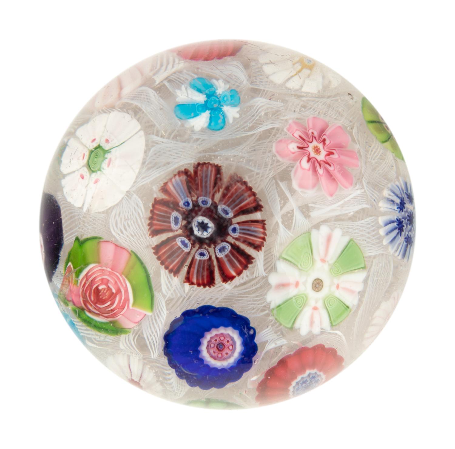 A Clichy Spaced Concentric Millefiori and Rose Cane on Upset Muslin Glass Paperweight