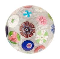 A Clichy Spaced Concentric Millefiori and Rose Cane on Upset Muslin Glass Paperweight
