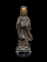 A Chinese Parcel-Gilt Bronze Figure of a Daoist Immortal, Longnv