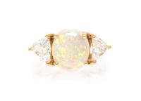 An 18 Karat Yellow Gold, Opal and Diamond Ring, 3.30 dwts.