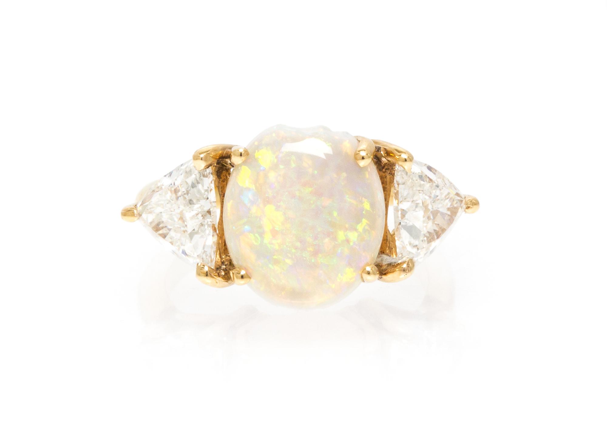 An 18 Karat Yellow Gold, Opal and Diamond Ring, 3.30 dwts.