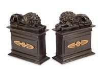 A Pair of Directoire Style Parcel Gilt Bronze Lion Ornaments