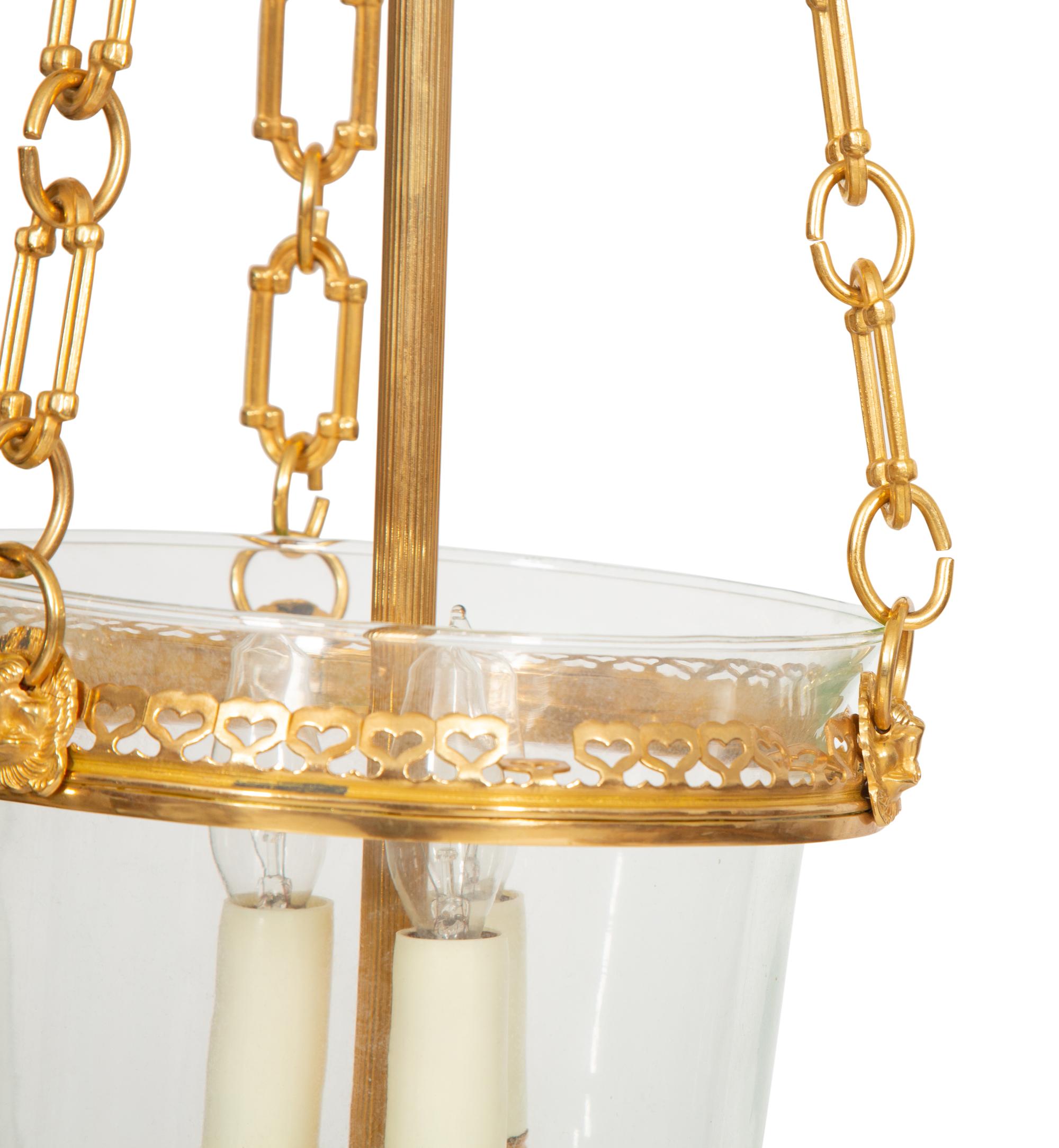 A Pair of French Gilt Metal and Glass Lanterns