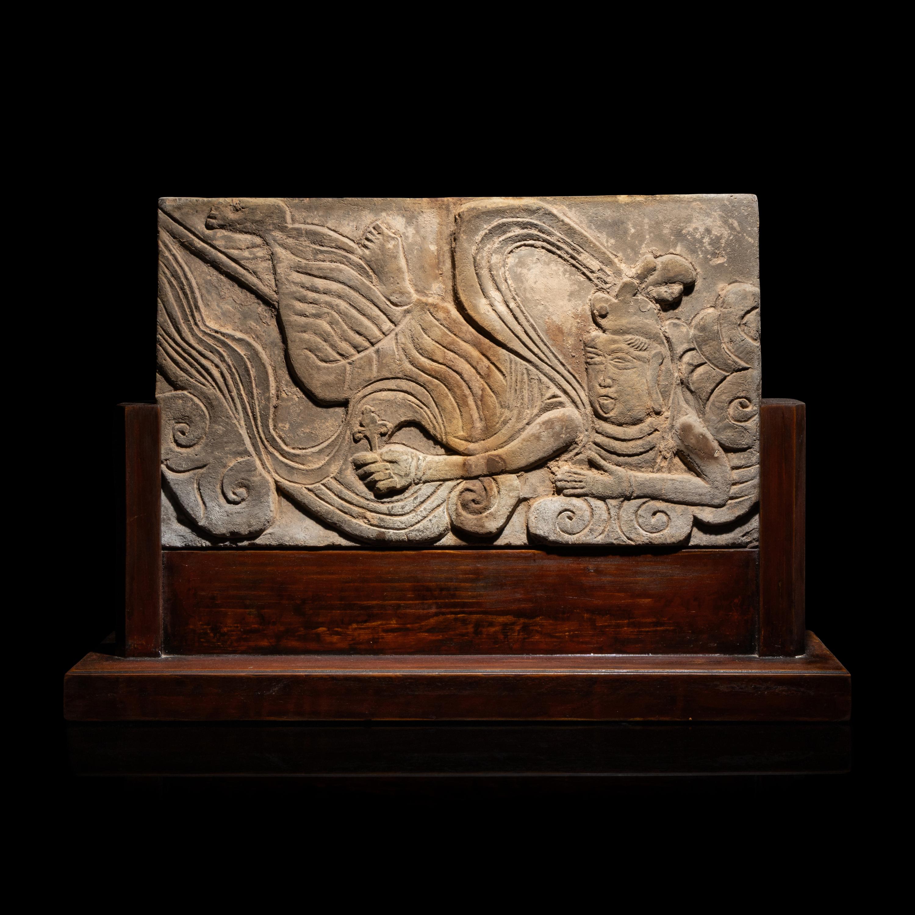 A Chinese Carved Terracotta 'Apsara' Panel, Liao Dynasty or Later — 遼或以後 磚雕祥云飞天
