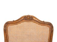 A Pair of Louis XV Style Caned Beechwood Fauteuils
