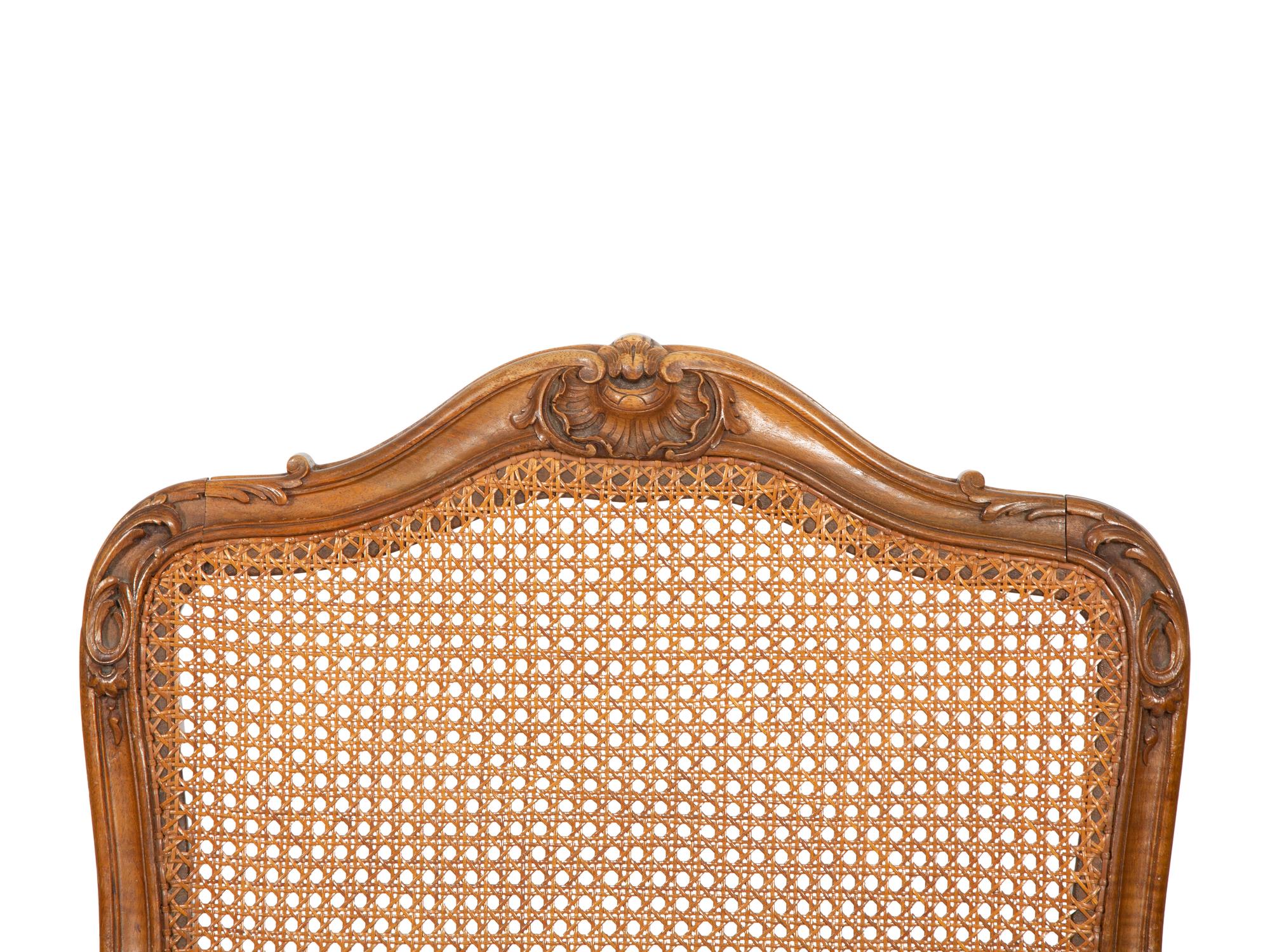 A Pair of Louis XV Style Caned Beechwood Fauteuils