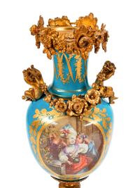 A Pair of Sèvres Style Gilt Bronze Mounted Porcelain Urns