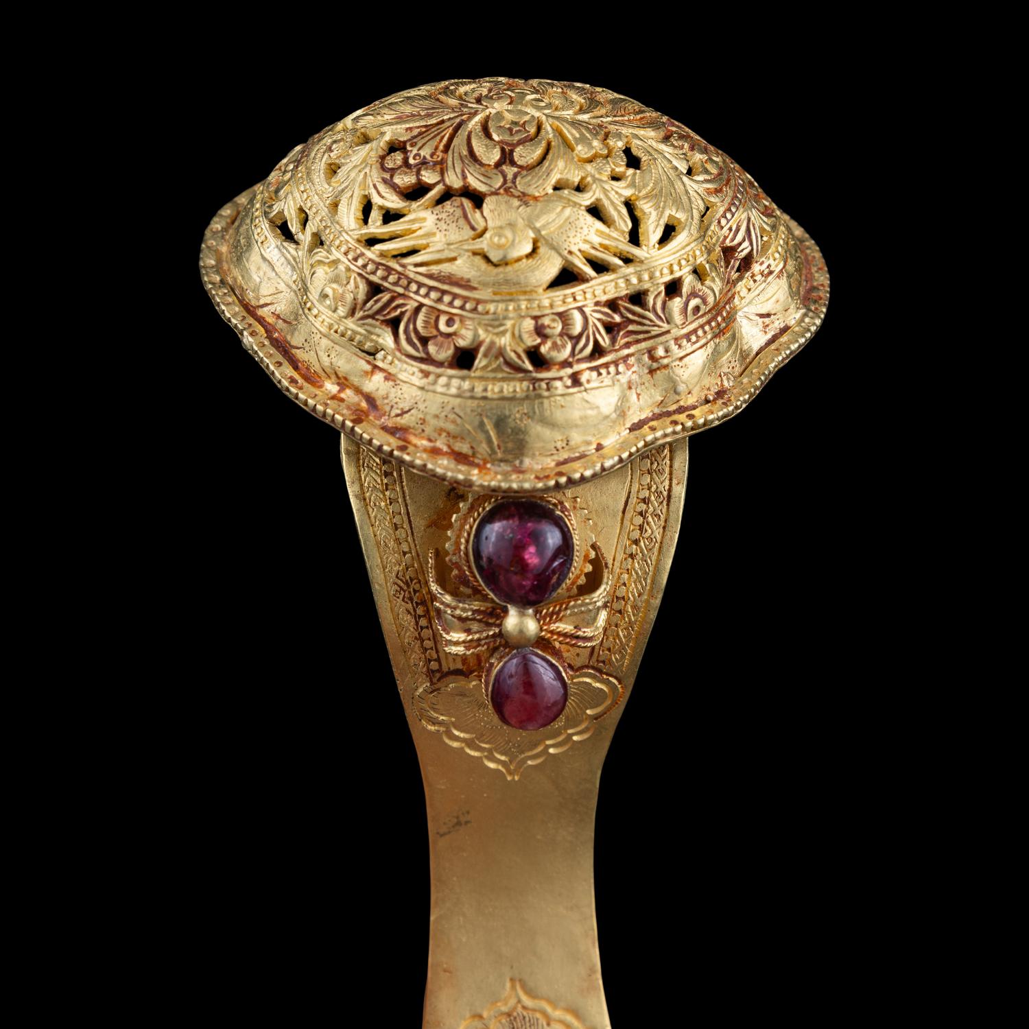 A Chinese Gold and Ruby Inset Ruyi -Shape Hair Ornament, Zan, Qing Dynasty 清 滇式嵌寶鏤空花卉紋如意金簪
