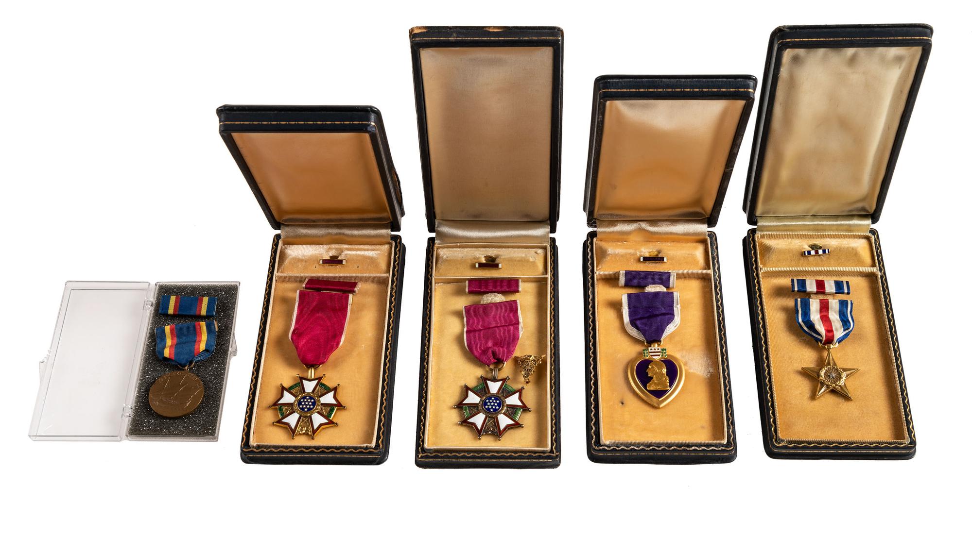 [WORLD WAR II AND PRE-WAR]. A group of 5 medals, including a Purple Heart, two Legion of Merit and one Silver Star.