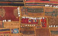 A Framed Cowrie Shell and Paillette-Applied Textile Panel