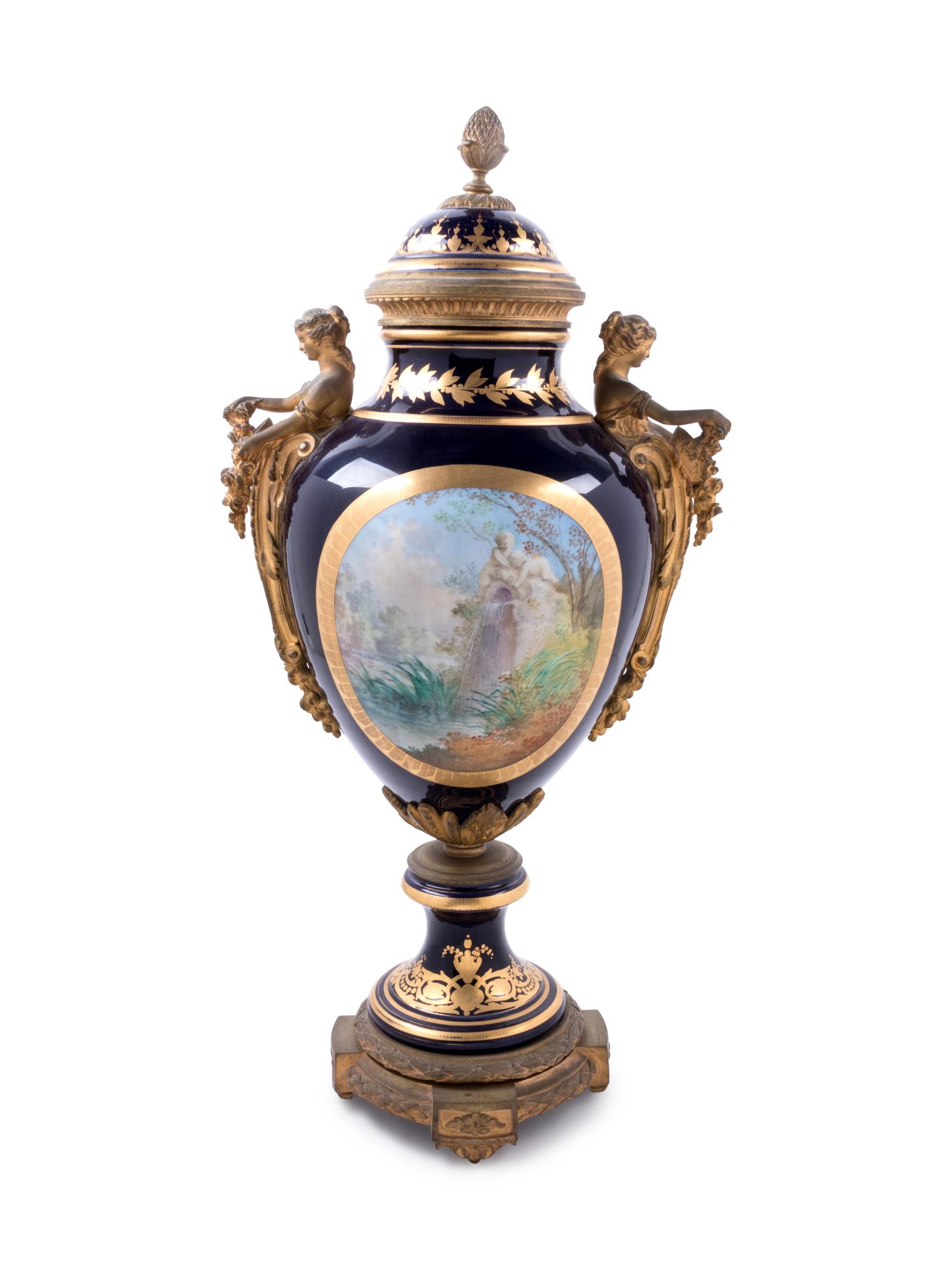 A Sèvres Style Gilt Bronze Mounted Painted and Parcel Gilt Porcelain Covered Urn