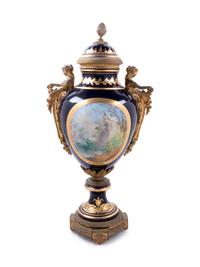 A Sèvres Style Gilt Bronze Mounted Painted and Parcel Gilt Porcelain Covered Urn