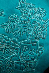 A Carved Turquoise-Glazed Porcelain Hu Vase