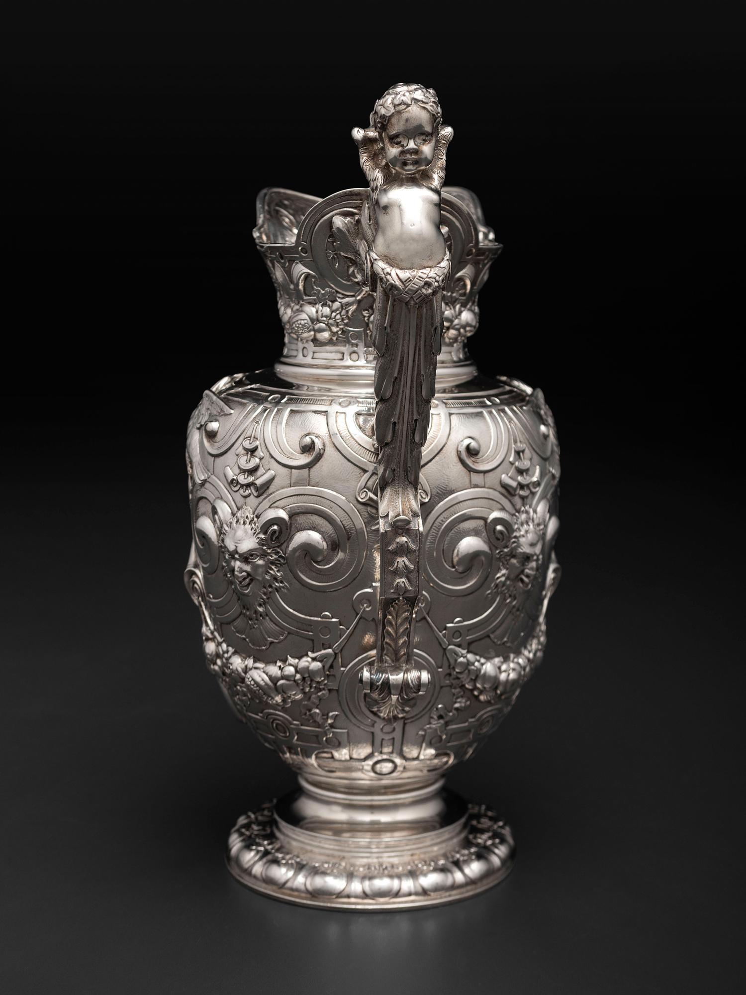 An American Baroque Style Repousse Silver Pitcher