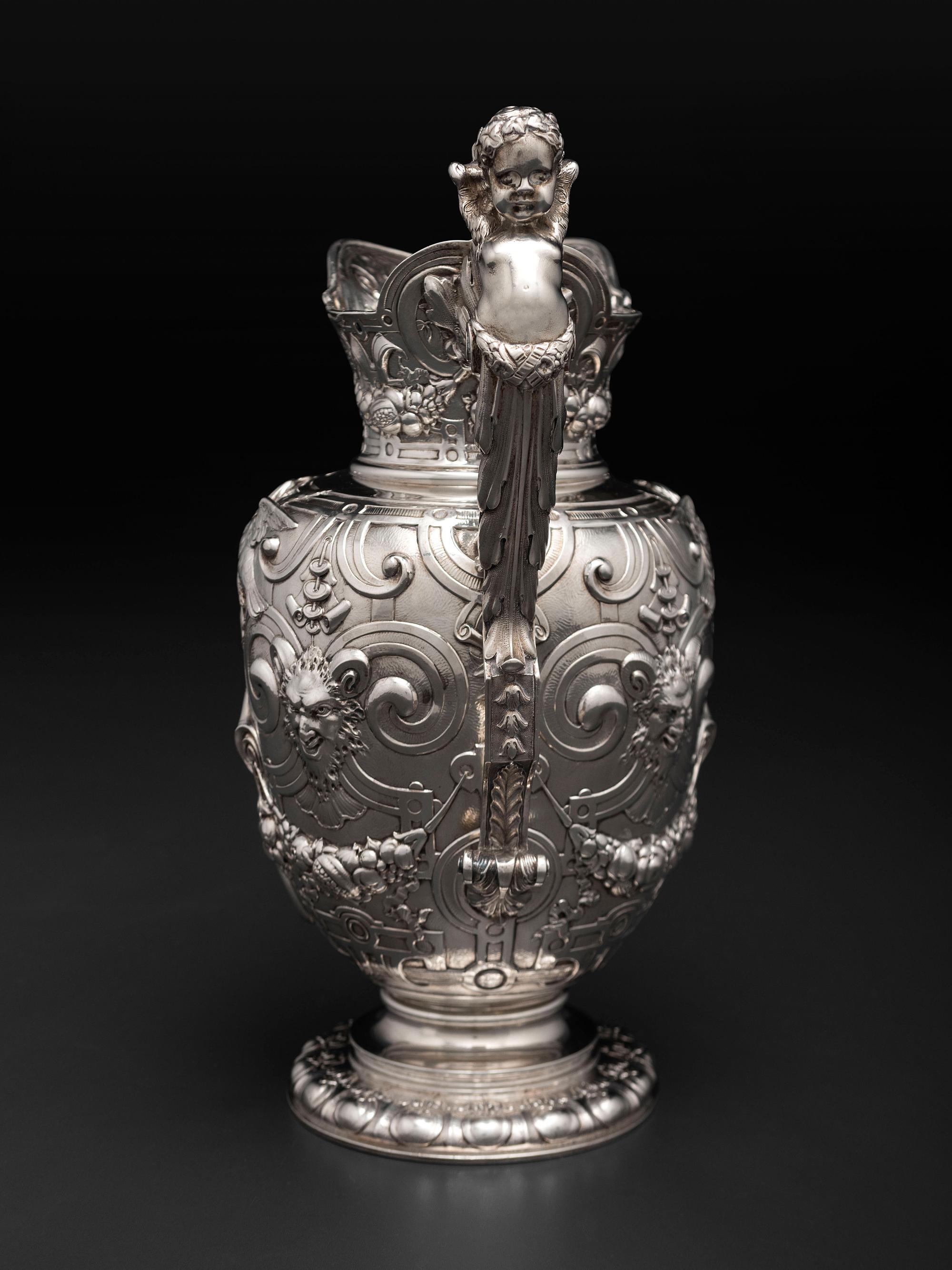 An American Baroque Style Repousse Silver Pitcher