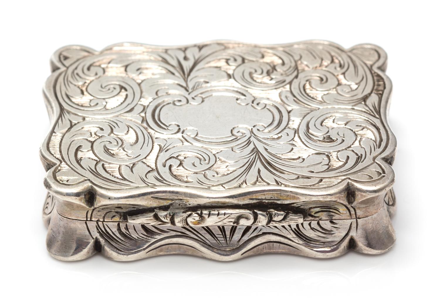 A Victorian Silver Vinaigrette, William & Edward Turnpenny, Birmingham, 1845, the case worked with foliate volute decoration, the lid c