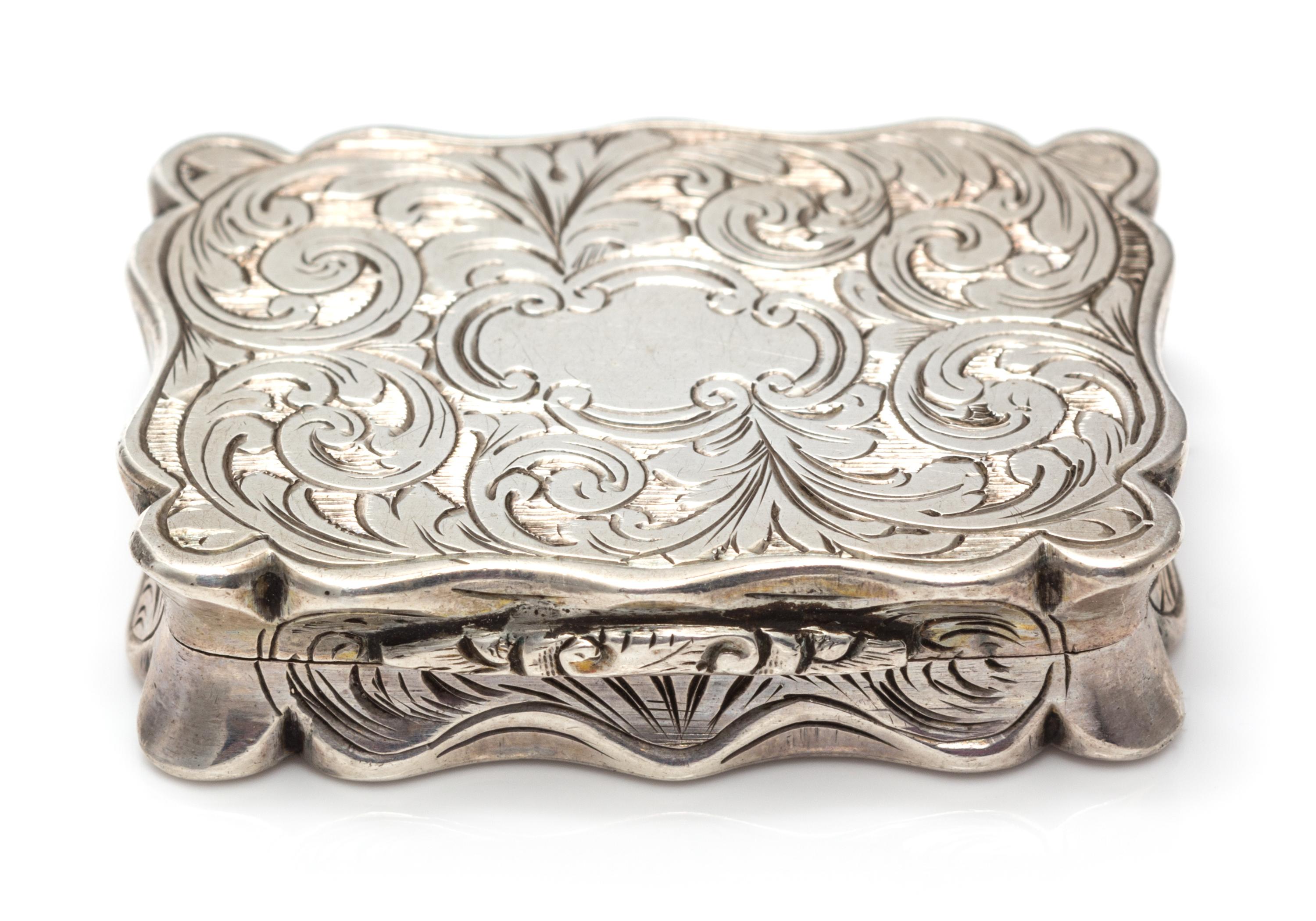 A Victorian Silver Vinaigrette, William & Edward Turnpenny, Birmingham, 1845, the case worked with foliate volute decoration, the lid c