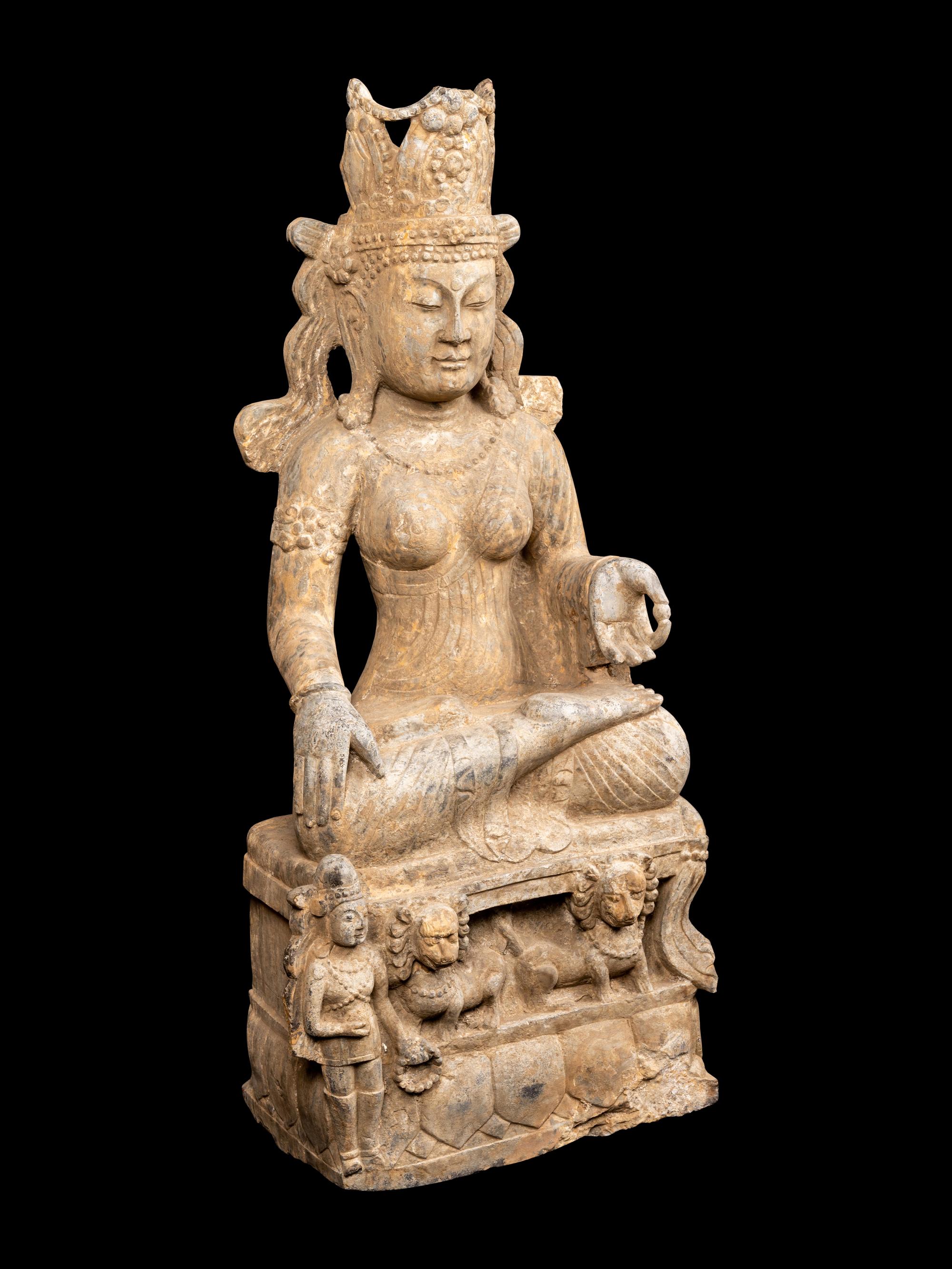 A Chinese Carved Stone Seated Guanyin Figure