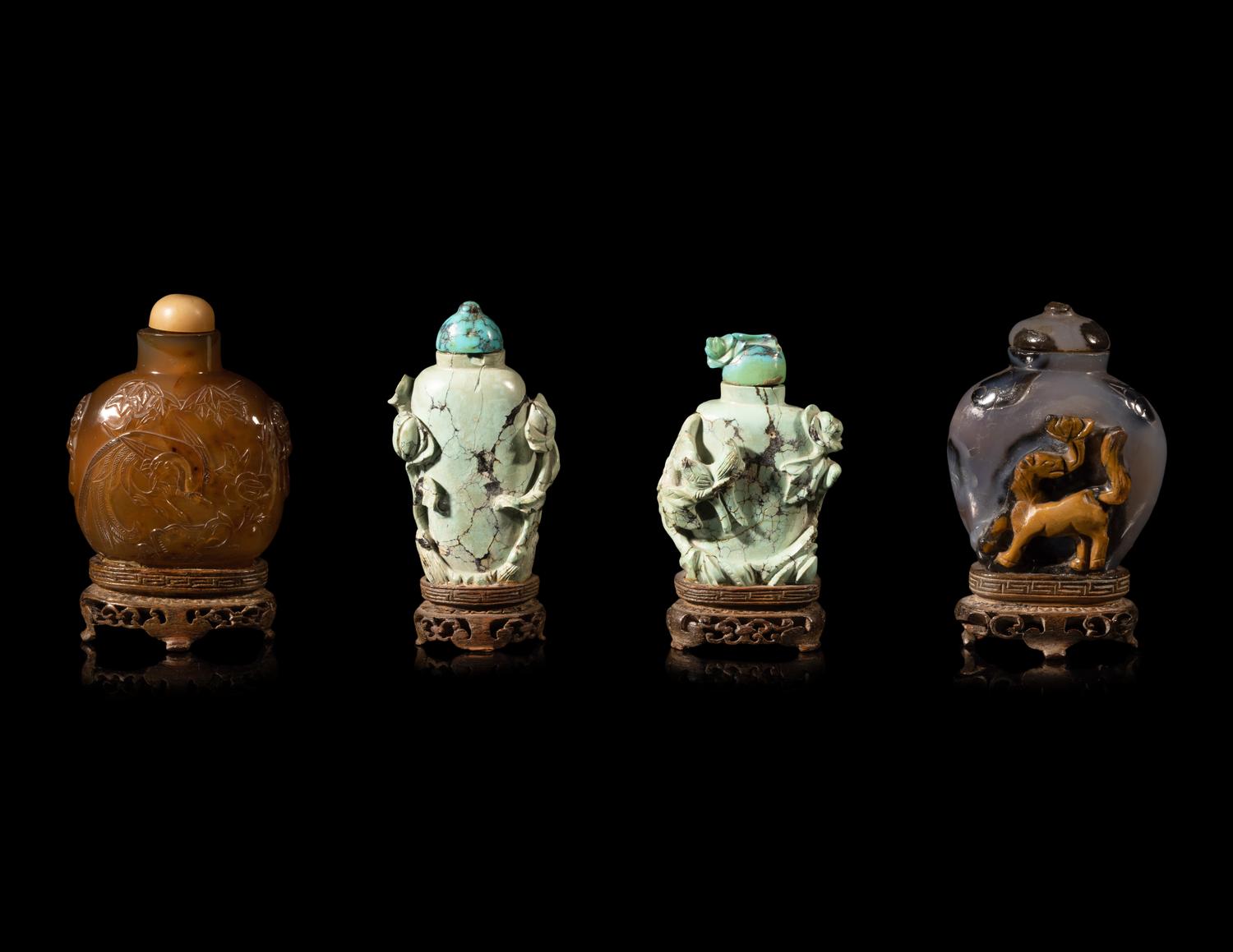 Four Chinese Carved Hardstone Snuff Bottles