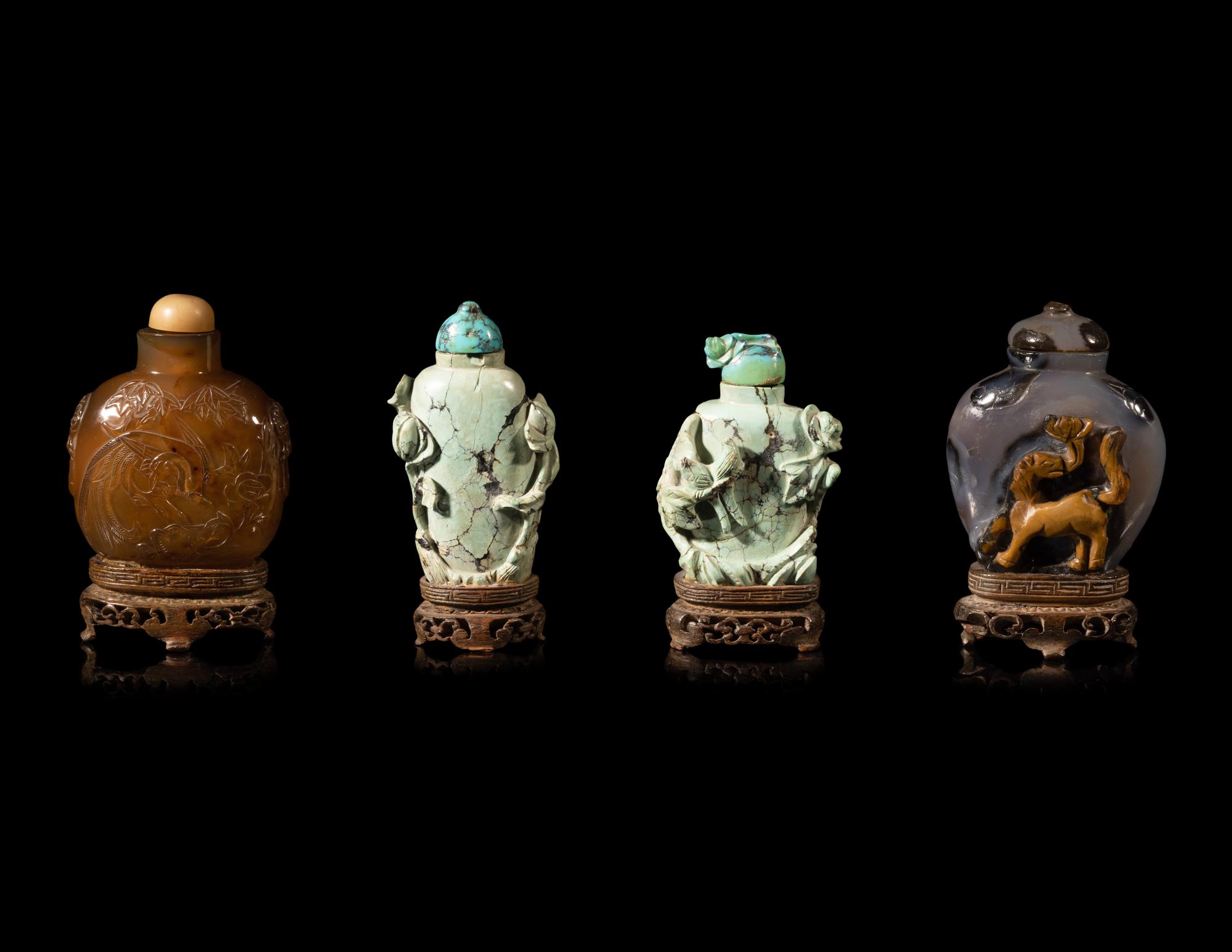 Four Chinese Carved Hardstone Snuff Bottles