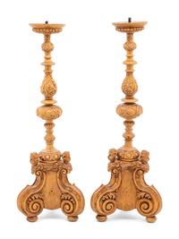A Pair of Continental Carved Wood Prickets