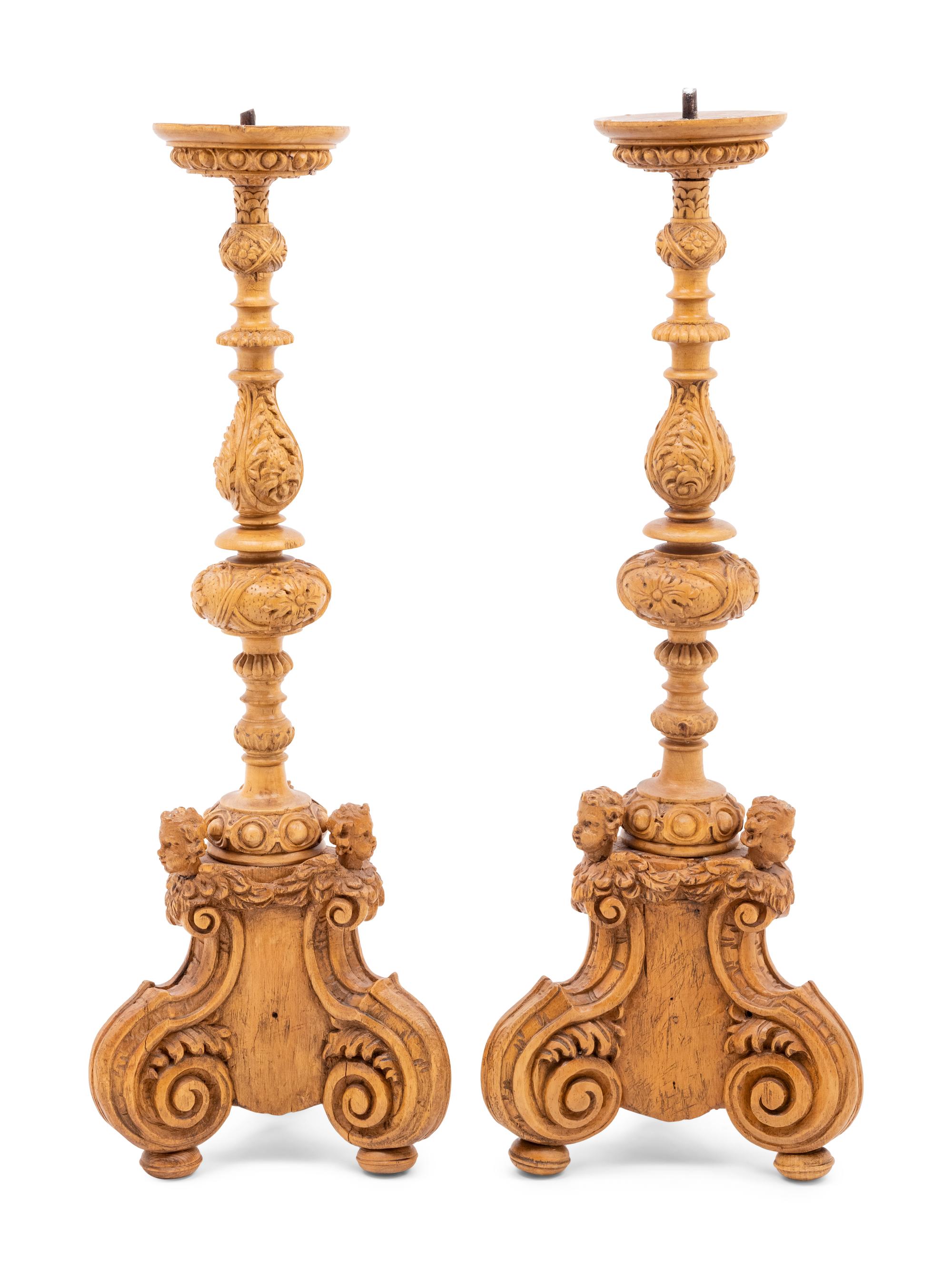 A Pair of Continental Carved Wood Prickets