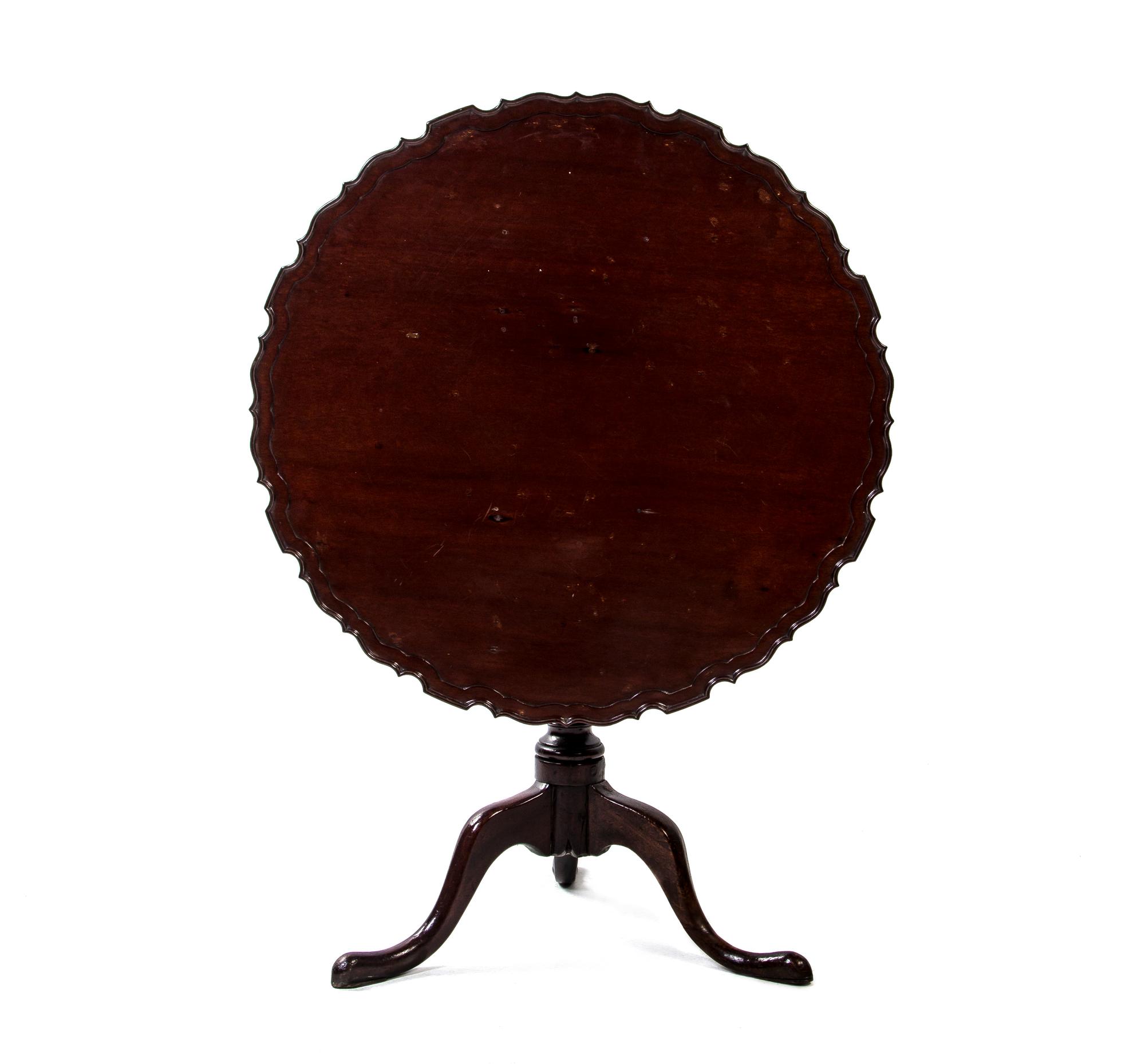 A George III Style Mahogany Tilt-Top Tea Table, Height 27 x diameter 33 inches.