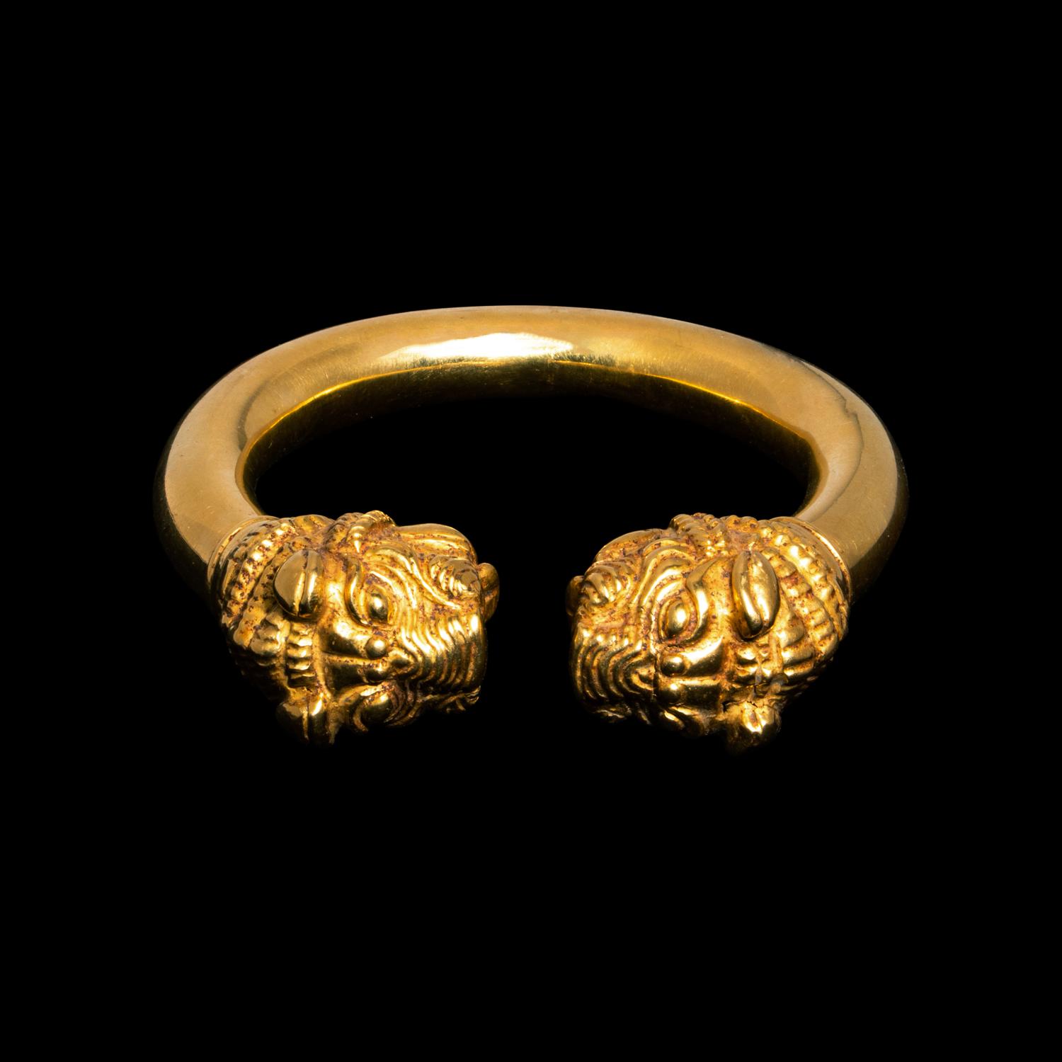 A Western Asiatic Gold Bracelet with Lion Headed Terminals