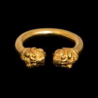 A Western Asiatic Gold Bracelet with Lion Headed Terminals