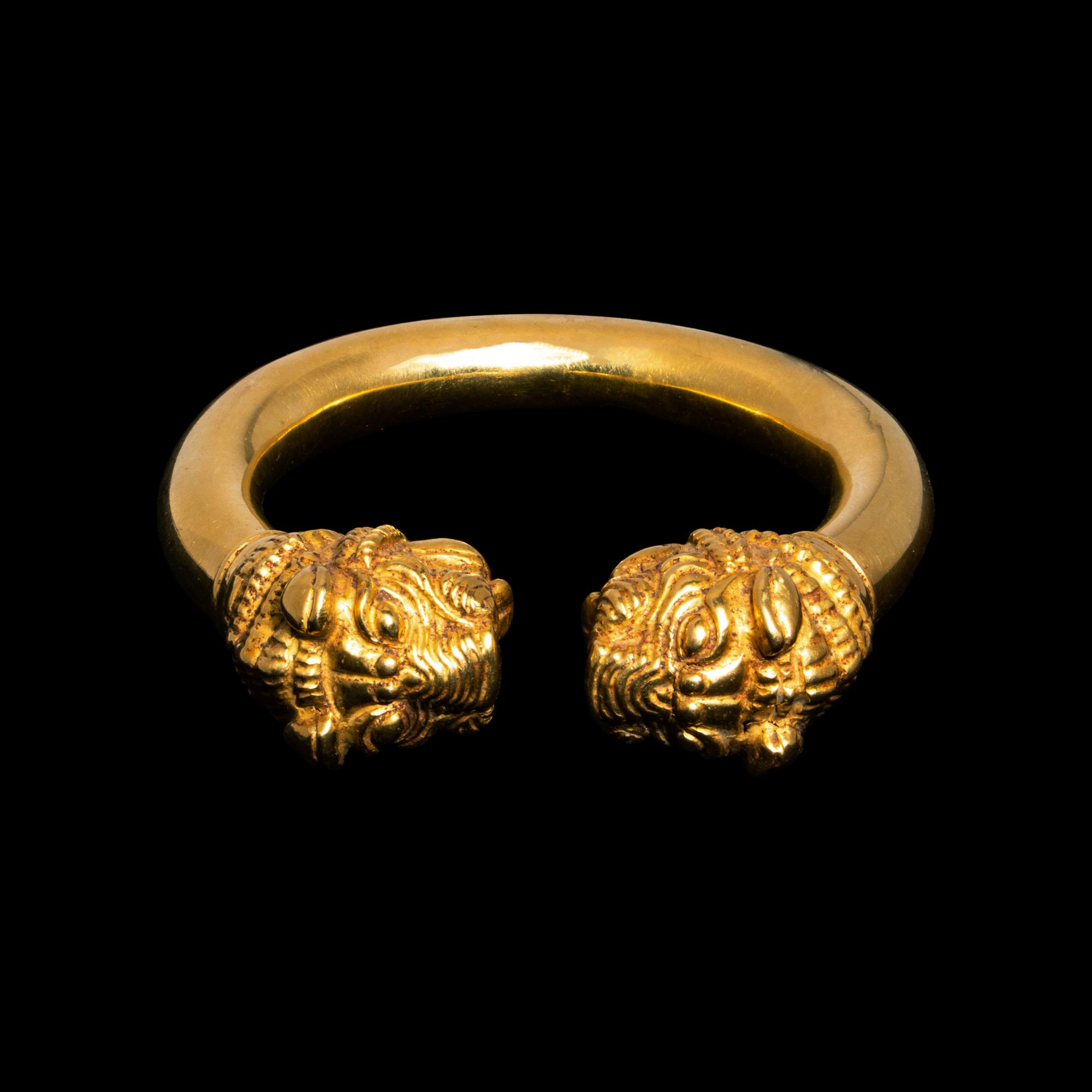 A Western Asiatic Gold Bracelet with Lion Headed Terminals